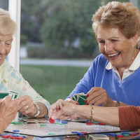 Senior women playing cards